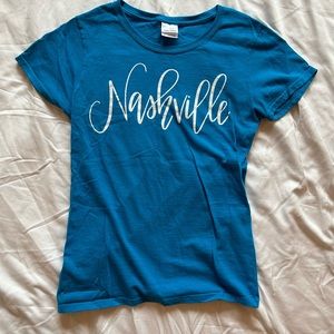 Blue short sleeve tee with “Nashville” writing